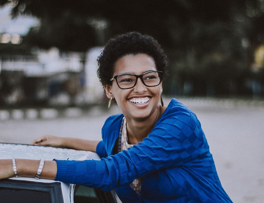 Smiling lady in blue sweater