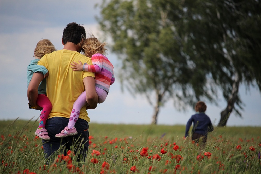 Main with children in field