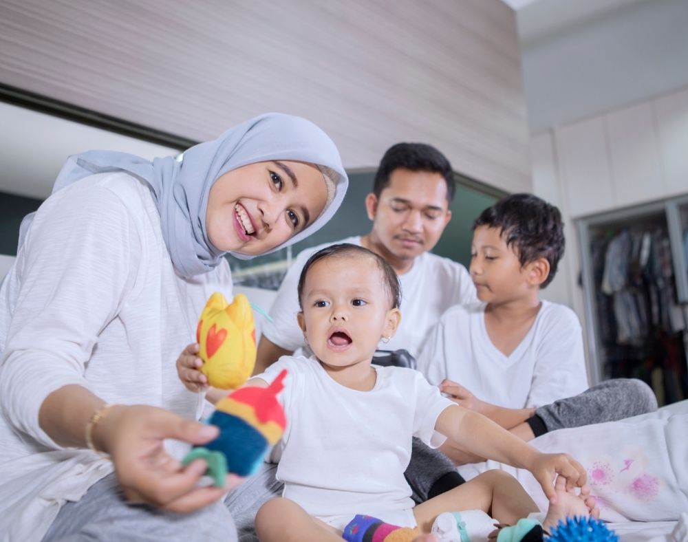 Young family playing on floor