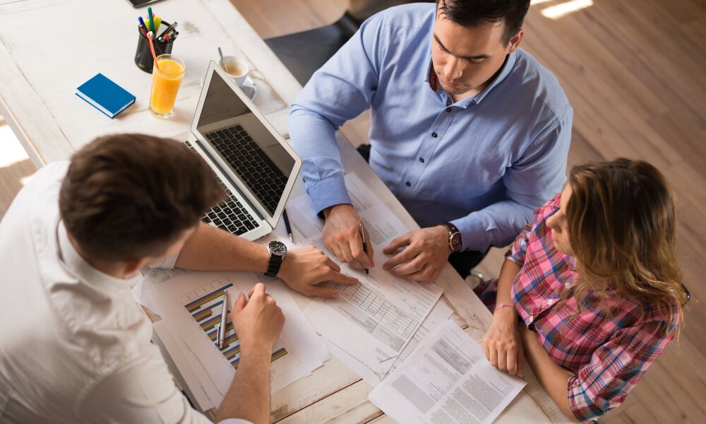 Couple talking to a professional about tax 