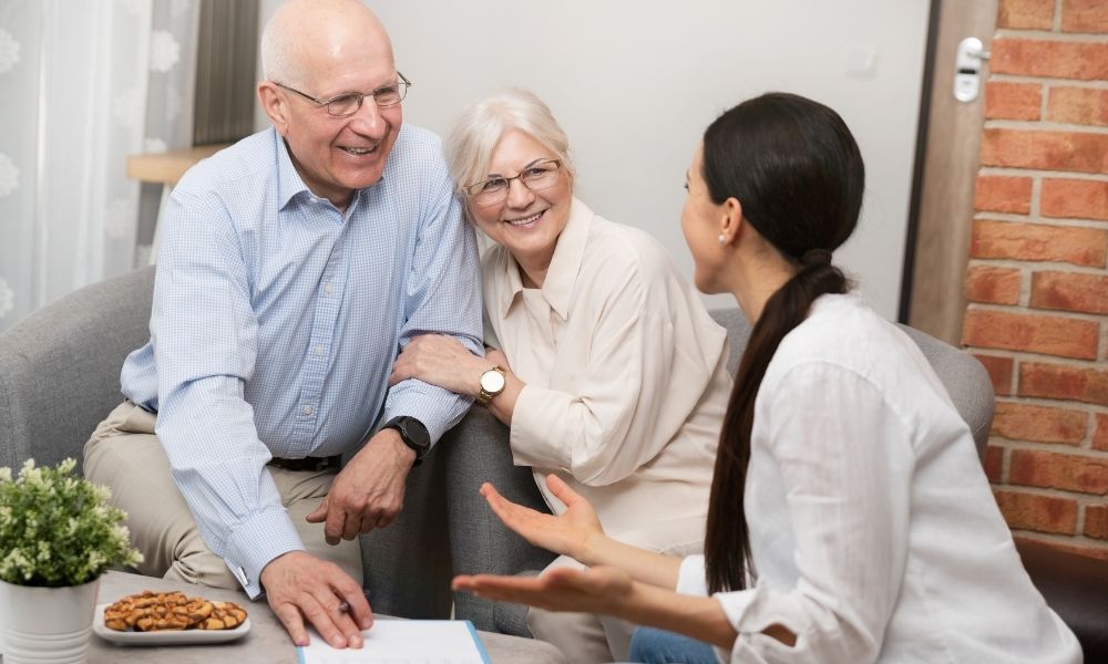 Woman in discussion with couple